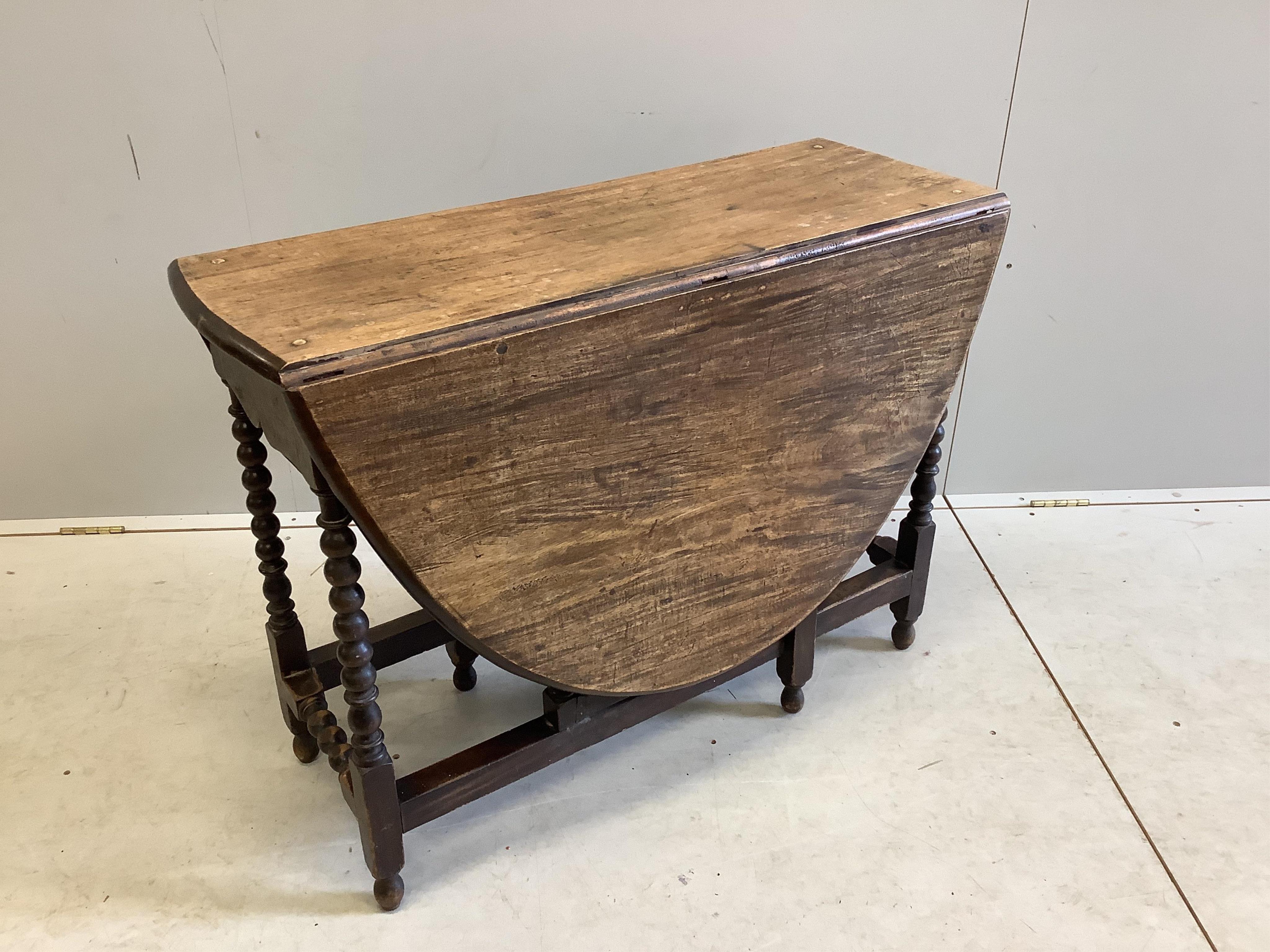 A 17th century style mahogany gate leg table, width 97cm, depth 37cm, height 72cm. Condition - fair